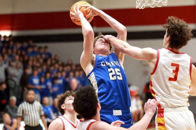 Geneva’s Hudson Kirby (left) gets a hand to the face by Batavia’s Jax Abalos during a game on Friday, Dec. 20, 2024 in Batavia