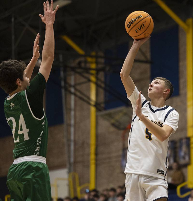 Sterling’s Bryce Hartman puts up a a shot against Alleman’s Robbie Wolfe Friday, Dec. 20, 2024, at Sterling High School.