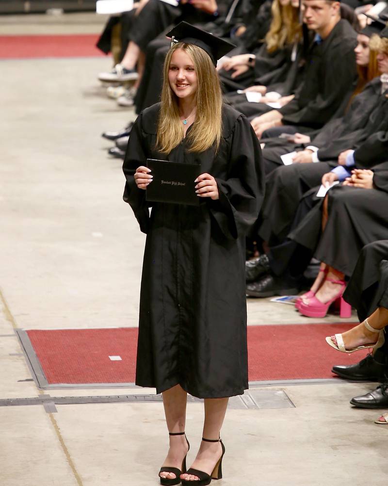 Sydney Clinnin poses with her diploma at the Kaneland High School Class of 2023 Graduation Ceremony on Sunday, May 21, 2023 in DeKalb.
