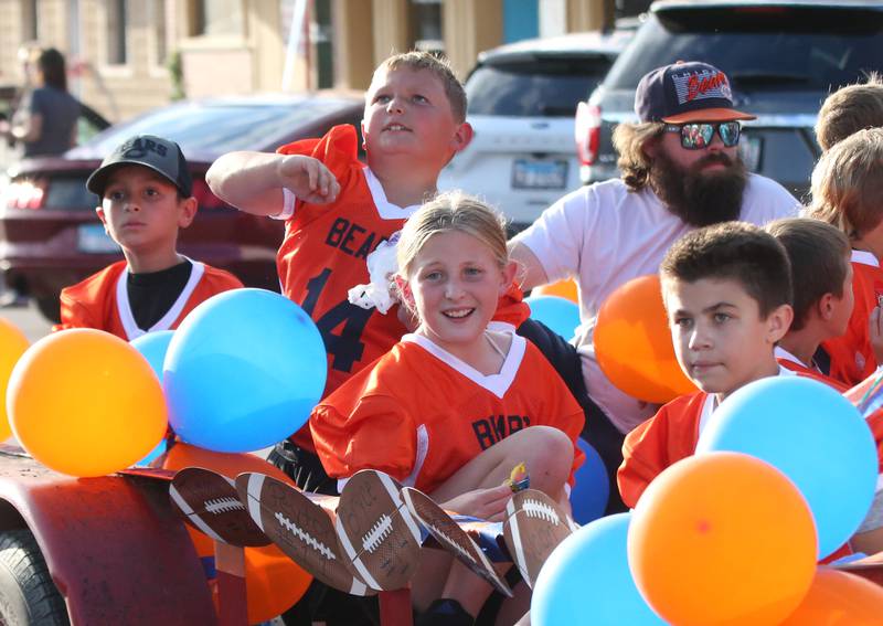 Spring Valley flag football players ride a float during the Hall High School Homecoming parade on Thursday, Sept. 28, 2023 in Spring Valley.