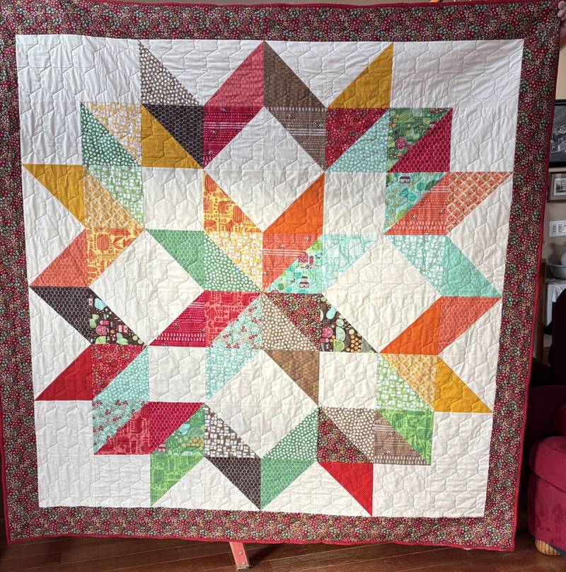 This is the quilt being raffled by the Leaf River Merry Martha Club. It is a generous 81 inches square and features fabrics that are 100 percent cotton from Farm Fun, a collection designed by Stacy Lest Hsu for world class textile manufacturer, Moda Fabrics.