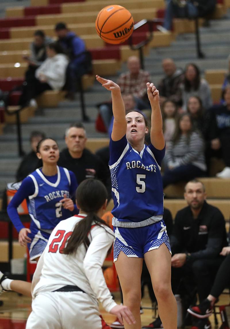 Burlington Central's Audrey LaFleur throws a three-pointer up over Huntley's Alyssa Borzych during a Fox Valley Conference girls basketball game on Tuesday Jan. 13, 2026, at Huntley High School.
