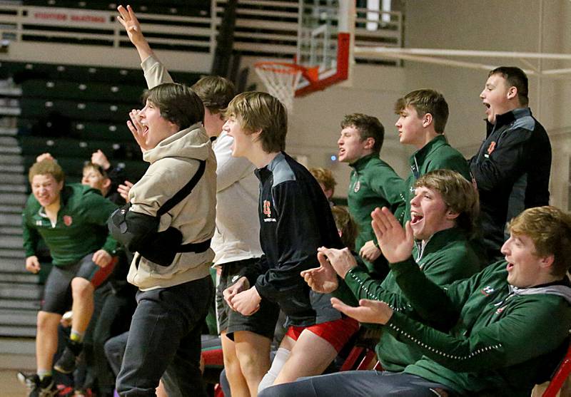 Members of the L-P wrestling team cheer for wrestler Zach Znaniecki during a wrestling meet against Ottawa in Sellett Gymnasium on Wednesday Dec. 7, 2022 at L-P High School.