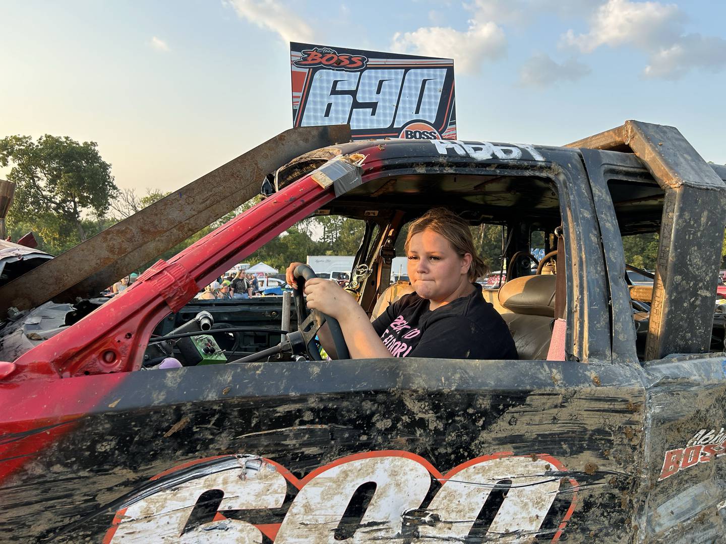 Abby Boss, 17, of Rock Falls, steers her demolition derby car on to its trailer after competing in the Young Gun heat at the Ogle County Fair's demolition derby on Saturday, Aug. 2, 2025.