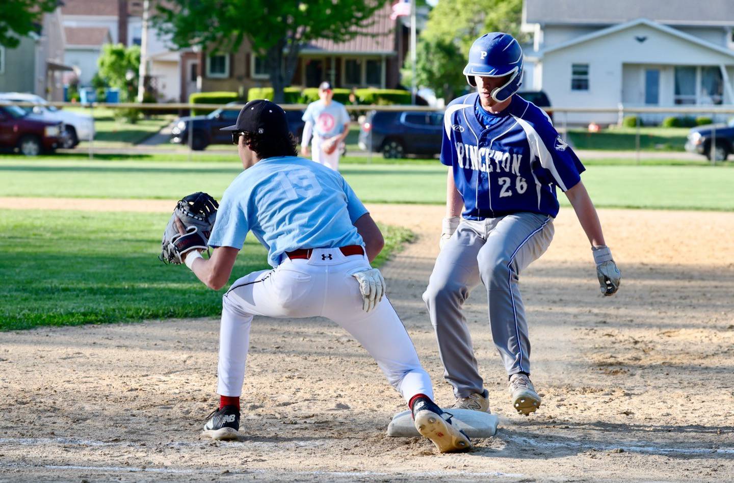 Princeton's jace Stuckey scoots back in to first base as Hall's Noah Plym awaits the throw Thursday at Kirby Park in Spring Valley. Hall won 4-1.