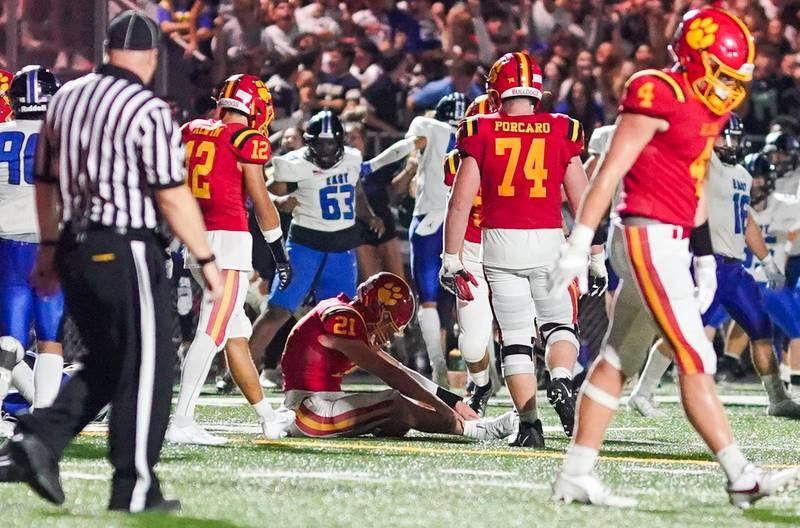 Batavia’s Ryan Boe (21) sits on the turf after being sacked on a two point conversion attempt against Lincoln-Way East during a football game at Batavia High School on Friday, Sep 1, 2023.