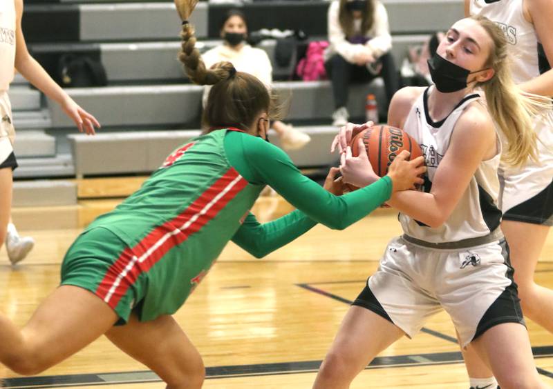 Kaneland's Alexis Schueler ties up LaSalle-Peru's Brooklyn Ficek during their game Wednesday, Feb. 9, 2022, at Kaneland High School in Maple Park.