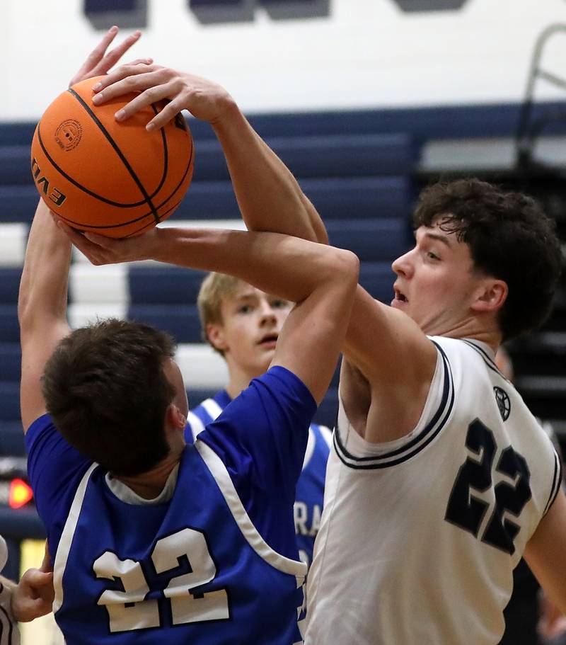 Cary-Grove's Adam Bauer (right) blocks the shot of Burlington Central's Cash Cumpata  during a Fox Valley Conference  boys basketball game on Wednesday Jan. 7,  2026, at Cary-Grove High School, in Cary.