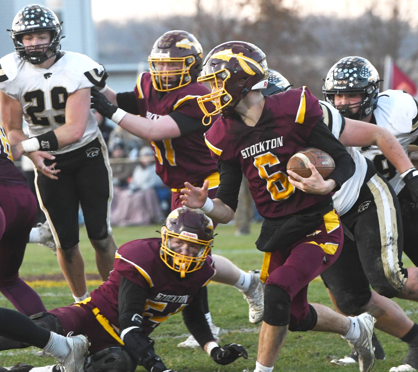 Stockton quarterback Noah Larson runs with the ball against Lena-Winslow in 1A semifinal action in Stockton on Saturday, Nov. 22, 2025.