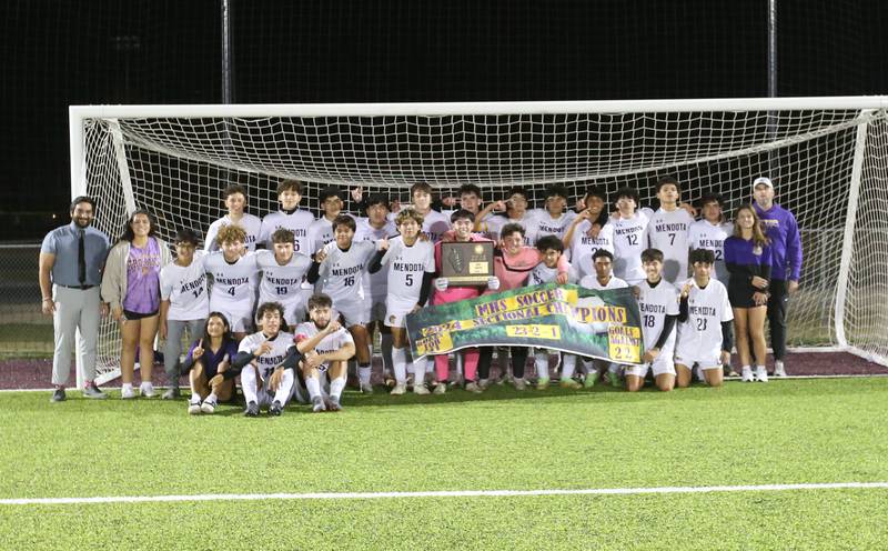 Members of the Mendota soccer team pose with the Class 1A Sectional trophy after defeating Peoria Christian on Wednesday, Oct. 30, 2024 at Chillicothe High School.