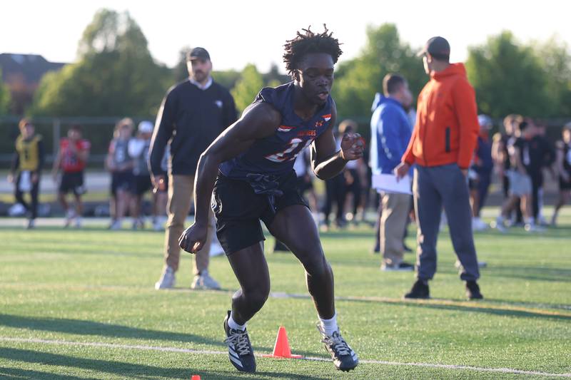 Oswego’s Ammar Banire runs a cone drill at the IHSA Southwest Suburb Showcase combine on Thursday, May 7, 2026 at Plainfield North High School.