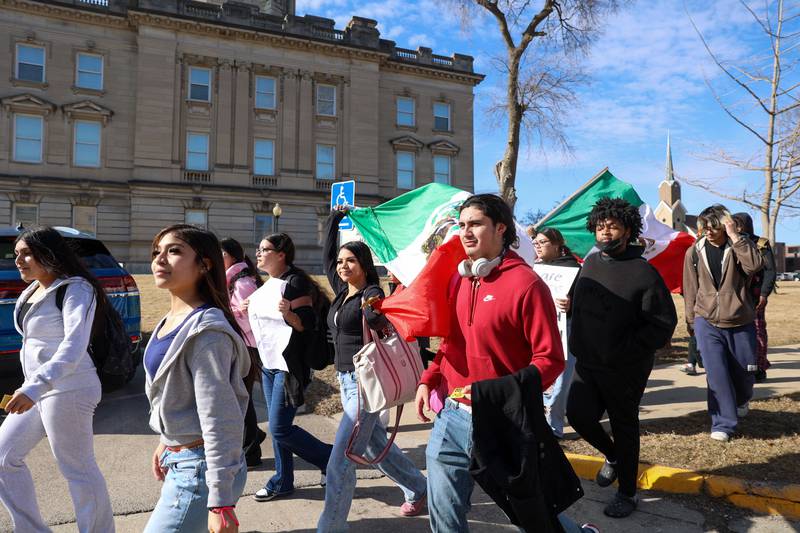 Kankakee High School students pass by the Kankakee County Courthouse as they participate in a walkout in protest of national immigration policies and Immigration and Customs Enforcement actions on Friday, Feb. 13, 2026.