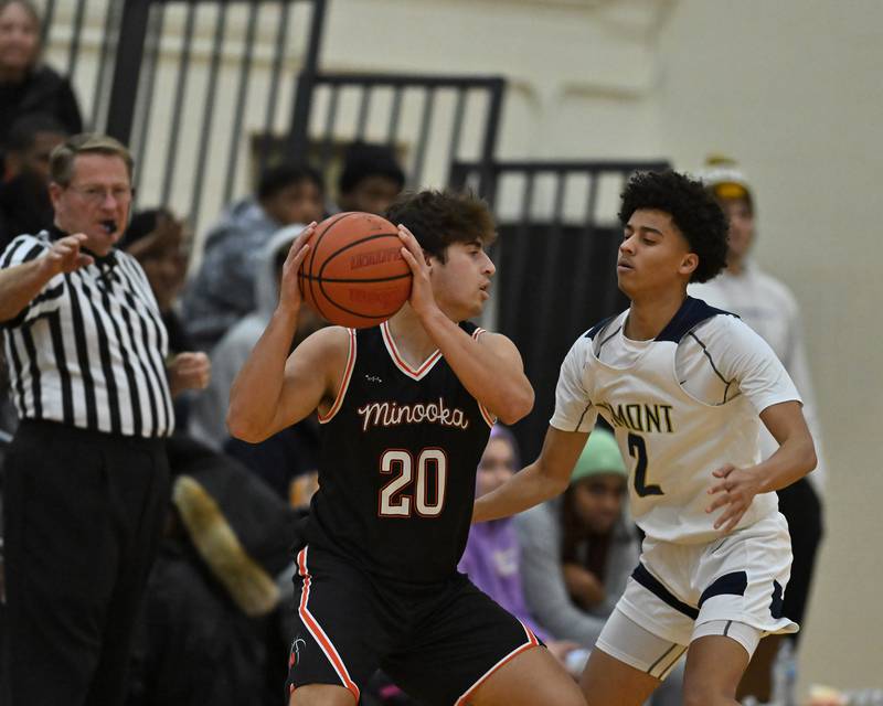 Minooka's Dom Cioni (20) looks to pass the ball in the WJOL Basketball Tournament on Monday, November 21, 2022, at Joliet.