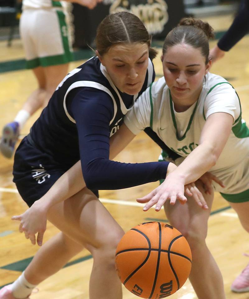 Cary-Grove's Aria Stanton battles with Crystal Lake South's Tessa Melhuish for a loose ball during a Fox Valley Conference girls basketball game on Friday, Jan. 23, 2026, at Crystal Lake South High School.