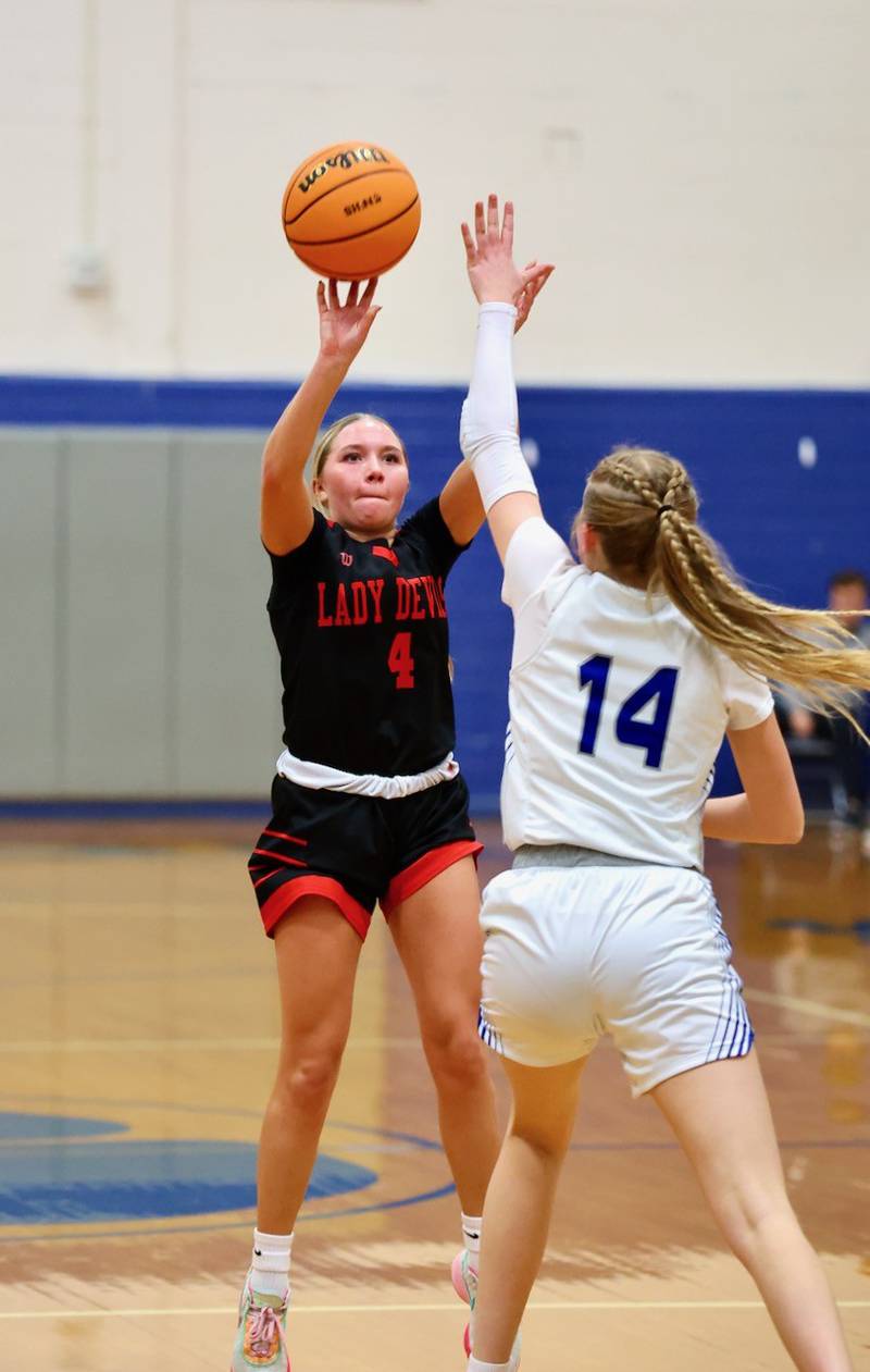 Hall's Charlie Pellegrini shoots a 3-pointer over Princeton's Payton Brandt Tuesday night at Prouty Gym. The Tigresses won 41-39.