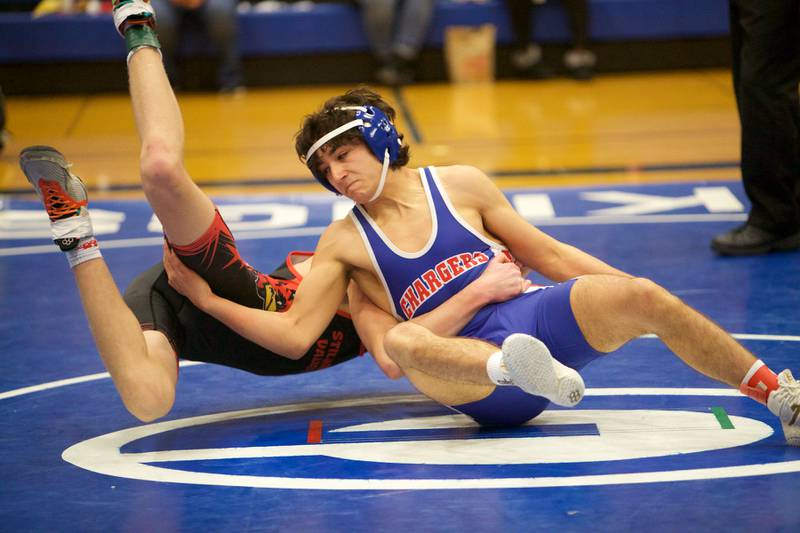 Dundee Crown's Vinnie Velazquez  competes with Stillman Valley's Brodie Watterson in the 132 lb. class at the Newbill Invitational on Saturday, Jan.6,2024 in Geneva.