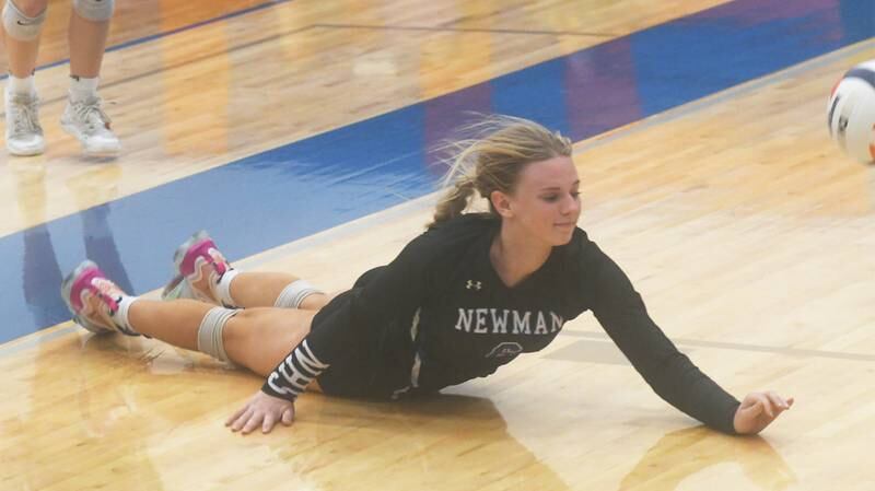 Newman's Jess Johns dives after a ball during a match against Stockton at the Linda Ludwig Memorial Volleyball Tournament in Lanark on Saturday, Oct. 15.