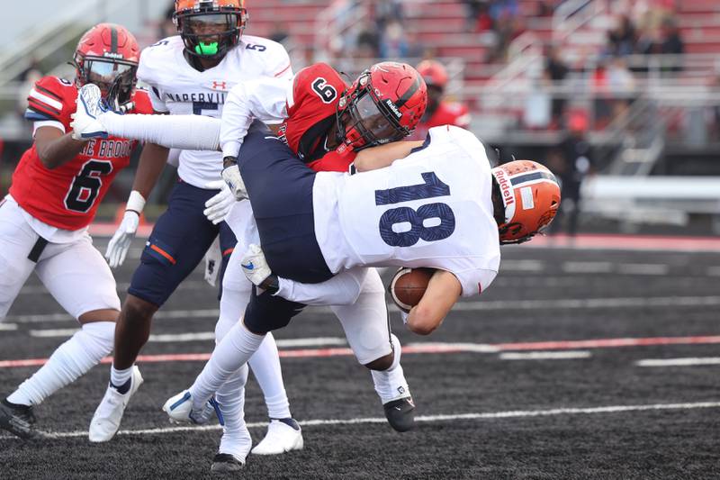 Bolingbrook’s Marquise Howard upends Naperville North’s Ian MacConnachie for a loss on Friday, Sept. 8, 2023 in Bolingbrook.