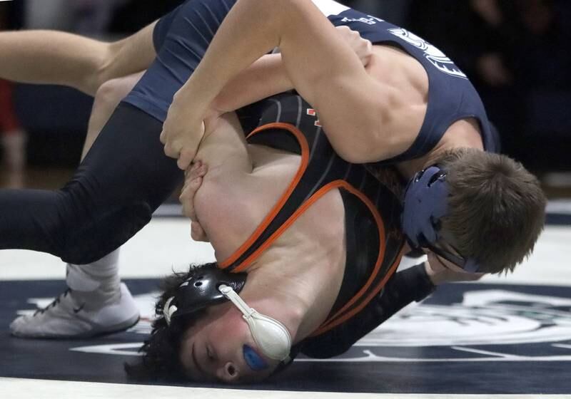 Crystal Lake Central’s Daniel Snow, bottom, battles Cary-Grove’s Levi Ardente at 132 pounds in varsity wrestling Thursday, Dec. 19, 2024 at Cary-Grove High School in Cary.