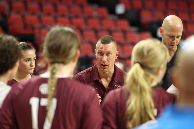 Lockport head coach Nick Mraz talks during a timeout during Benet Academy's victory in two sets, 25-23, 25-16, over Lockport in the IHSA Class 4A State semifinals on Friday, Nov. 14, 2025.