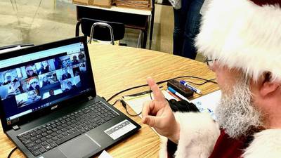 Grieving Trinity Catholic Academy students in La Salle get a pick-me-up from Old St. Nick