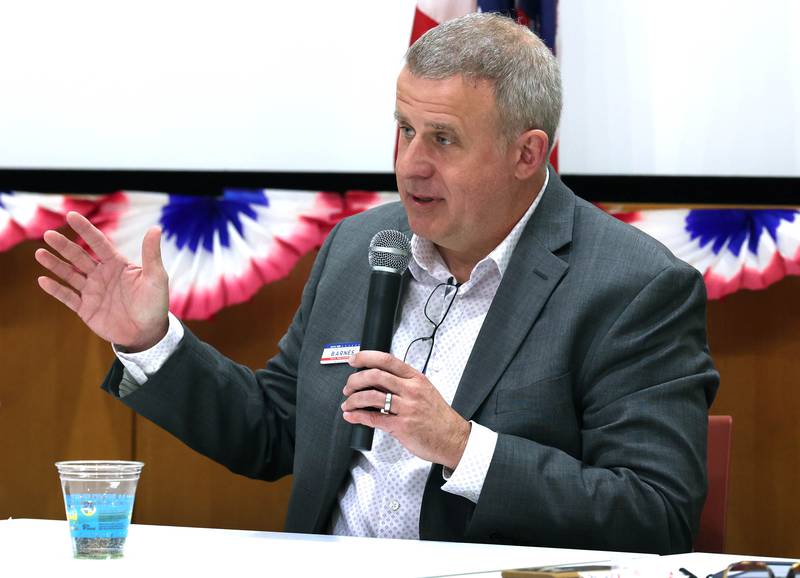 Democratic candidate Cohen Barnes, who is vying for the nomination for the 76th district seat in the Illinois House of Representatives, answers a question Saturday, Feb. 3, 2024, in a meet the candidates forum at the DeKalb Public Library. Democratic candidates Amy Murri Briel and Carolyn Zasada also spoke at the event organized by DeKalb Stands and co-sponsored by the DeKalb County Democrats.