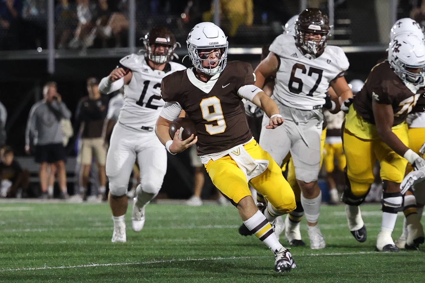 Mount Carmel's Jack Elliott battles Joliet Catholic on Friday, Oct. 11, 2024, in Chicago.