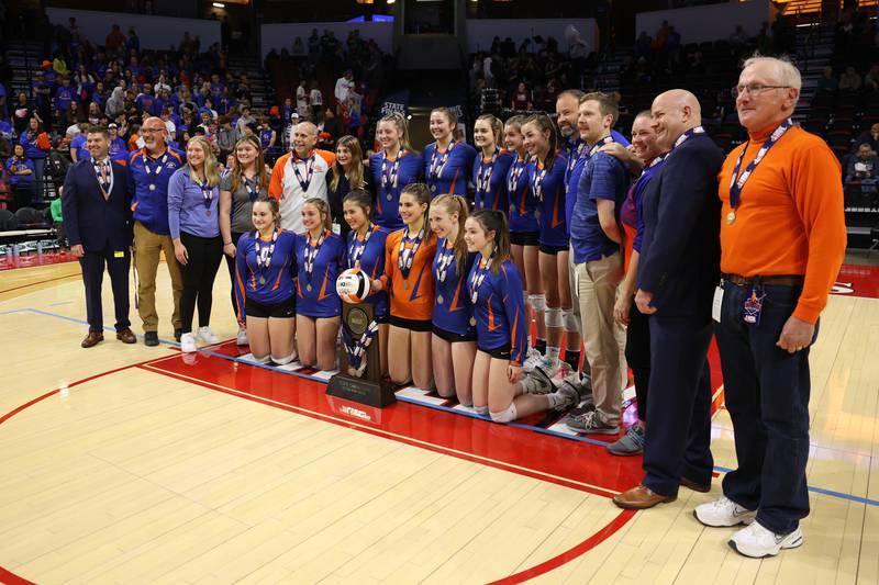 Genoa-Kingston poses with the championship trophy after their win over IC Catholic in the Class 2A championship match on Saturday in Normal.