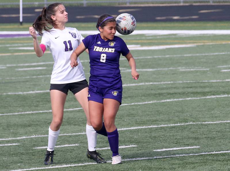 Mendota's Linnea Escatel puts a header on the ball in front of Dixon's Leah Stees on Wednesday, May 1, 2024 at Mendota High School.