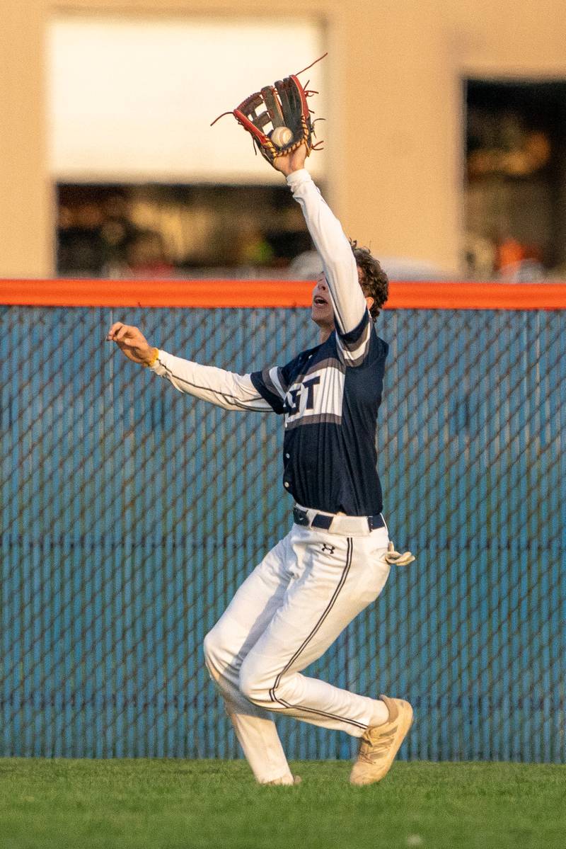 Oswego East's Michael Polubinski (1) makes a catch for an out against Oswego during a baseball game at Oswego High School on Tuesday, May 9, 2023.