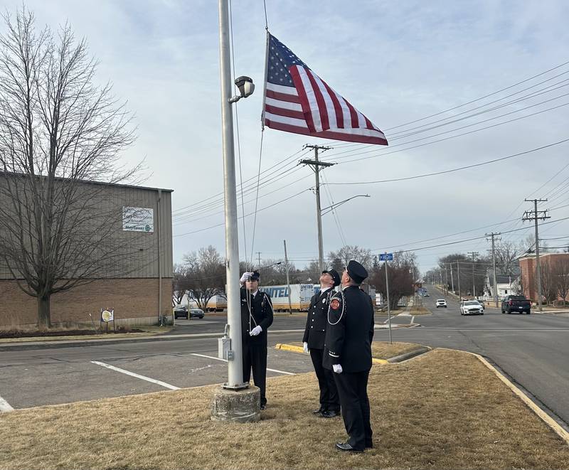 Sycamore firefighters hoist the American flag at an opening ceremony on Tuesday, Feb. 17, 2026, to mark the opening of the Sycamore Fire Department's new fire station, 1351 S. Prairie Drive.  The station will replace the aging building at 535 DeKalb Ave.