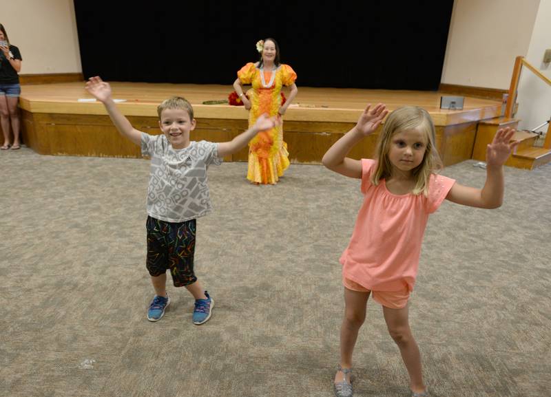Children including Addison Williams of Downers Grove and Alaina Stickley of Lombard learn how to Hula dance with the help of Downers Grove resident Shasta Hud who attending the Unplug Illinois Day held at the Downers Grove Park District Saturday July 8, 2023.