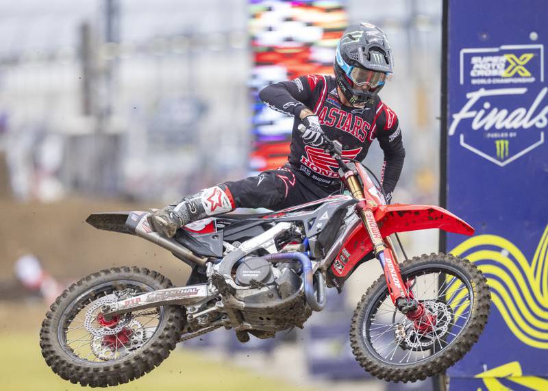 Illinois native and Supercross Champion Chase Sexton uses his body weight to turn his 450cc motorbike midair during qualifying at the Super Motocross Finals at Chicagoland Speedway on September 16, 2023.