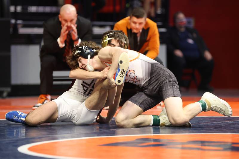St. Charles’ Ben Davino rolls Loyola’s Massey Odiotti in the Class 3A 120lb. championship match at State Farm Center in Champaign. Saturday, Feb. 19, 2022, in Champaign.