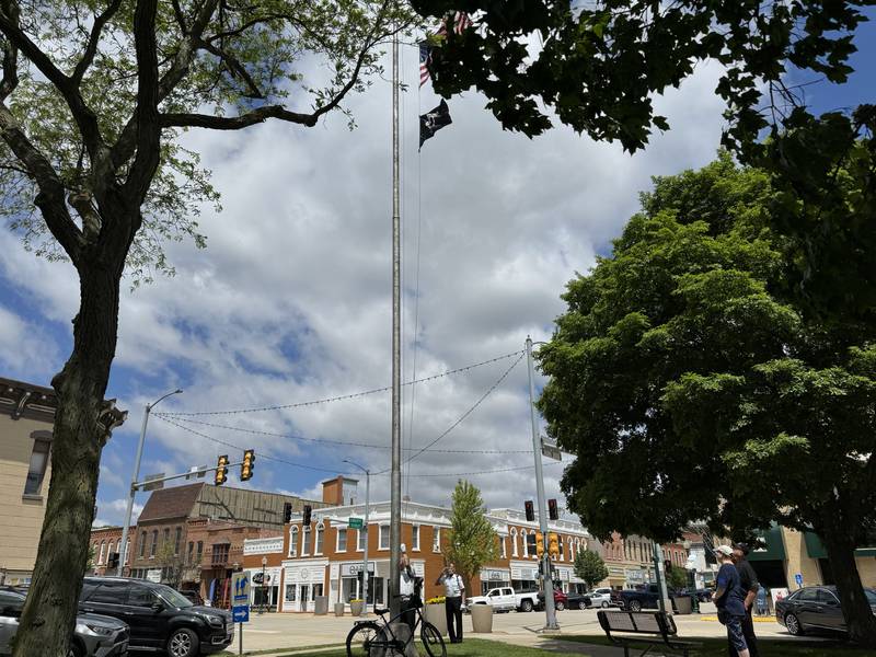 Members of the Morris Color Guard raise the flags from half staff during the 2024 Morris Memorial Day ceremony.