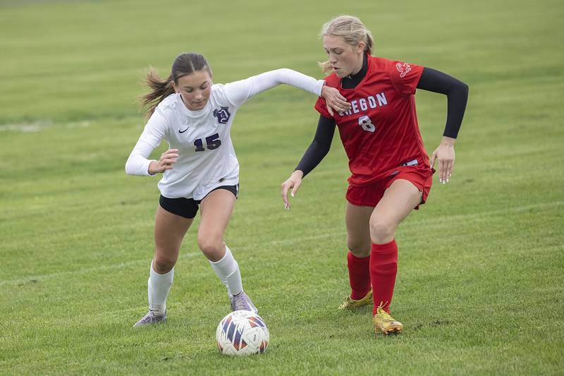 Dixon’s Jenna Harrison works against Oregon’s Addison Rufer Thursday, May 1, 2025.