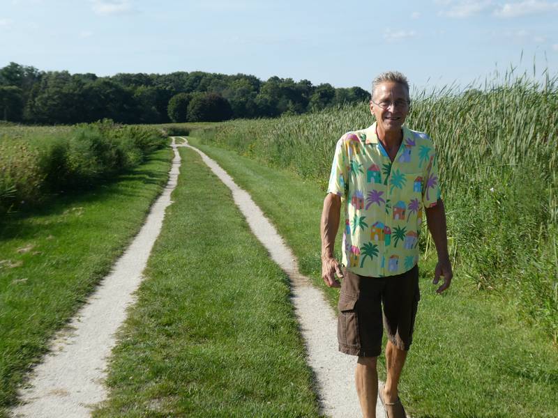 Crystal Lake resident Bob Miller, shown here, organized a petition with over 100 signees this past month to raise concerns over the condition of trails in the wetlands portion of Lippold Park. Miller showed the Northwest Herald around the wetlands on Wednesday, Aug. 24, 2022.