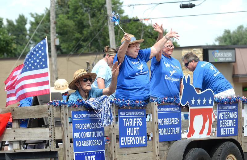 Arlene Sangemeister and Mary Francis (center) wave to the crowd as they ride on the Ogle County Democrats float during the Let Freedom Ring parade on Friday, July 4, 2025 in Mt. Morris.