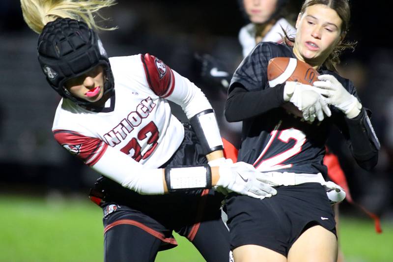 Huntley’s Aubrina Adamik, right, tussles with Antioch’s Reese Queensland in IHSA Regional varsity flag football action at Crystal Lake Central High School in Crystal Lake on Wednesday, Oct. 8, 2025.