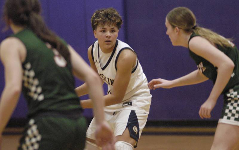 Sterling's  Joslynn James  eyes Lincoln's defense.  The Sterling Golden Warriors played  the Lincoln Railsplitters in the Dixon Holiday Tournament at Reagan Middle School in Dixon on Friday, December 26th, 2025.