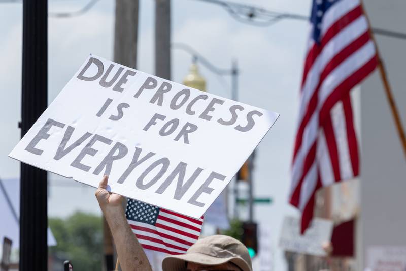 Sign that reads “Due Process is for Everyone” is held at the “No Kings” protest on Saturday, June 14, 2025 at Rotary Park in Princeton.