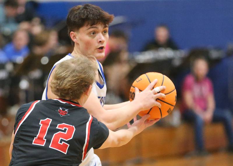 Princeton's Owen Hartman looks to pass the ball around Hall's Hunter Edgcomb on Friday, Feb. 13, 2026 at Princeton High School.