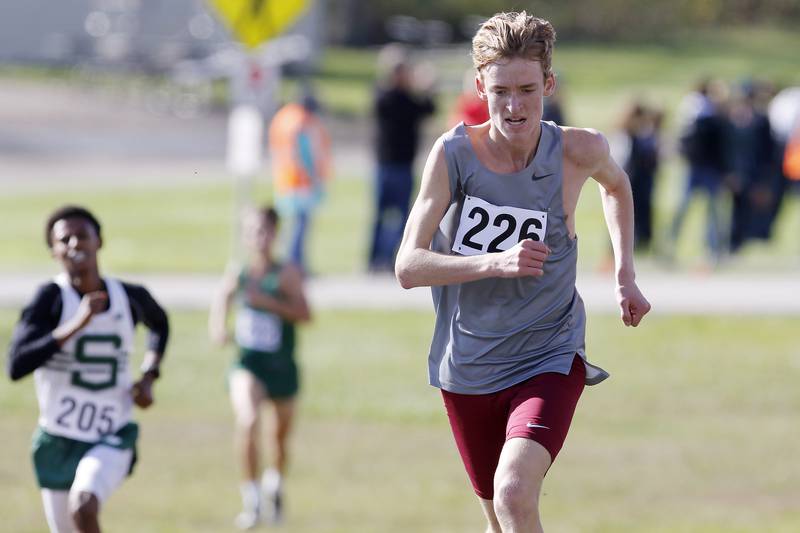 Prairie Ridge's Will Gelon heads for the finish line to place fifth during the boys Class 2A Woodstock North XC Sectional at Emricson Park on Saturday, Oct. 30, 2021 in Woodstock.