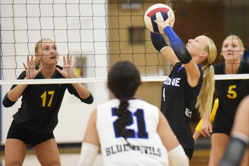 Peotone's Allie Werner, second from right, sets the ball while, from left, Coal City's Maggie Carlson, Peotone's Ella Stupegia and Coal City's Averie Hodgen look on during a game at Peotone Thursday, Sept. 18, 2025.