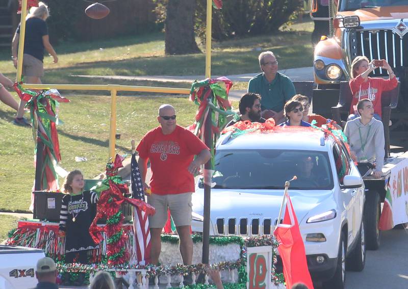 La Salle Mayor Jeff Grove and Peru Mayor Ken Kolowski ride floats during the L-P Homecoming parade on Thursday, Sept. 26, 2024 near the corner of 7th Street and Orleans Street in Peru.
