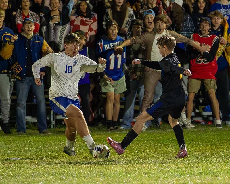 Austin Roop (10) of Hinckley-Big Rock and Lane Rohrer (10) of Somonauk/Leland/Newark fight over possession of ball during the Little Ten Conference Championship match on Thursday, Oct. 9, 2025 at Hinckley-Big Rock School in Hinckley.