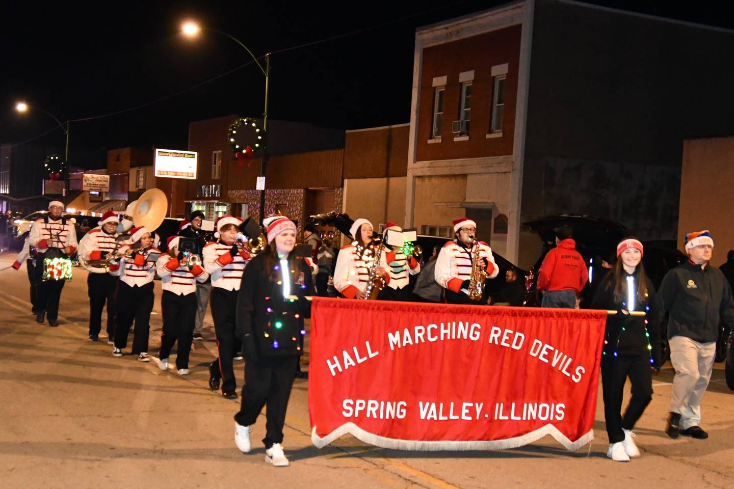 The Hall High School Marching Red Devils performing during Saturday's Lighted Christmas Parade in Spring Valley