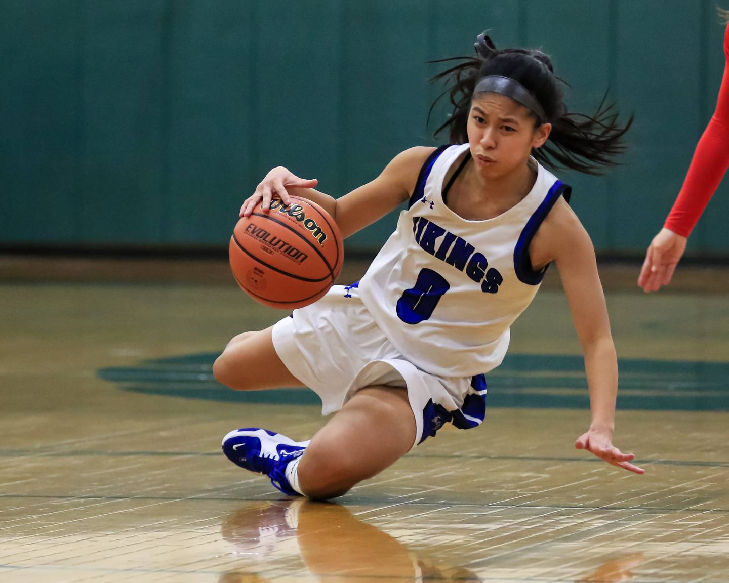 Geneva's Rilee Hasegawa (0) slips with the ball during Class 4A Glenbard West Sectional final game between Geneva at Batavia.  Feb 23, 2023.