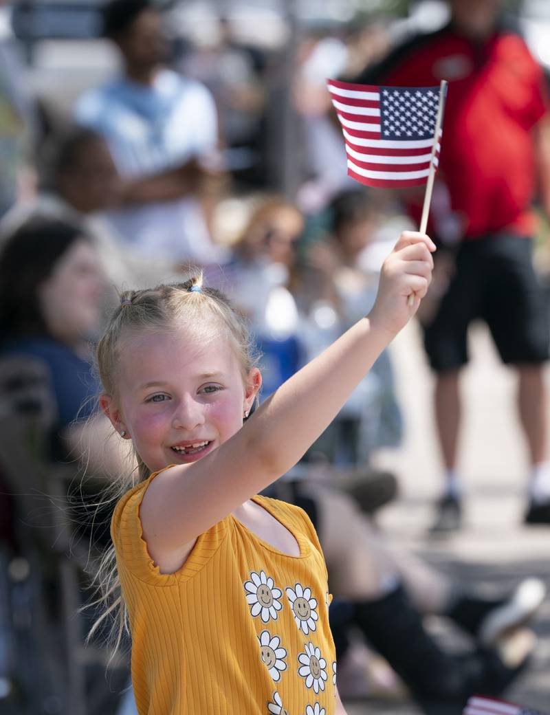 Evelyn Kokalichev, 6, of Elburn, watches the festivities during the 75th annual Swedish Days parade on Sunday, June 22, 2025 in downtown Geneva. The event, sponsored by the Geneva Chamber of Commerce, was the final event of the festival that ran June 18th-22th.