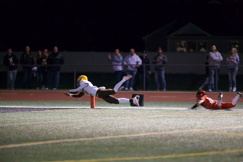 Jacob's Antonio Brown dives for the touchdown as Huntley's Zack Garfio was not able to make the stop on Friday, Sept. 23,2022 in Huntley.